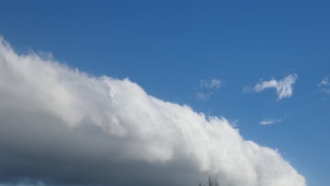 Arcus-Clouds-move-steadily-across-the-sky-on-a-sunny-Autumn-day---Canterbury,-New-Zealand