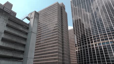 Looking-up-at-modern-office-building-architecture-in-financial-district-of-Downtown-Atlanta,-Peachtree-Center