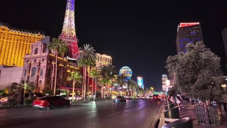 Vibrant-night-scene-of-Paris-Las-Vegas-with-Eiffel-Tower-and-bustling-traffic-on-the-Las-Vegas-Strip