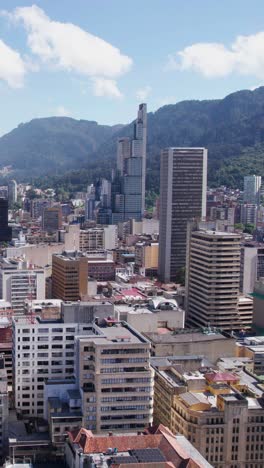 Vertical-Aerial-View,-Downtown-Bogota-and-BD-Bacata-South-Tower,-Tallest-Skyscraper-in-Colombia