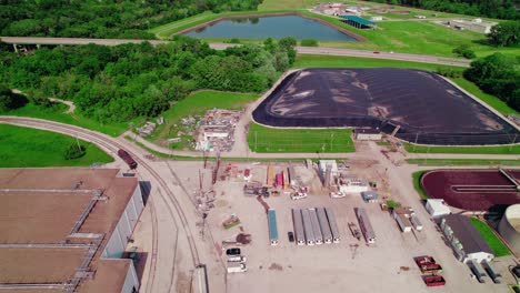 Aerial-shot-showing-reefer-trailers-parked-at-a-distribution-center-in-Ottumwa,-Iowa,-adjacent-to-a-wastewater-treatment-plant