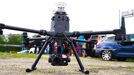 Industrial-drone-at-outdoor-showcase-event-on-gravel-ground,-Czechia