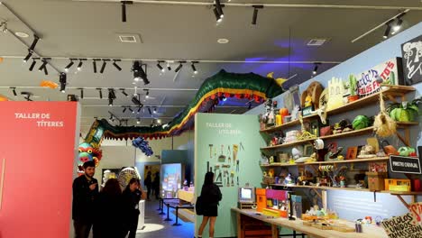 People-looking-at-TV-show-prop-inside-the-31-Minutos-Museum,-in-Santiago-de-Chile