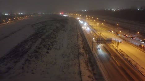 -Snow-Removal-Crews-Clears-the-Road-at-Night,-Montreal,-Quebec,-Canada,-Aerial