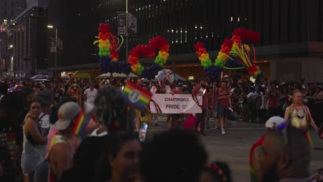 Pride-parade-participants-carrying-balloons-that-spell-out-'Love'-during-pride-parade-and-celebration-in-Houston,-Texas