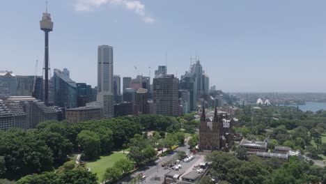 Aerial-drone-view-of-Hyde-Park,-Australia,-with-iconic-landmarks:-the-Sydney-Tower-Eye,-St