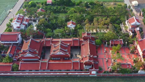 Aerial-tracking-flyover-Chifa-Matsu-Temple-Complex-in-the-middle-of-agricultural-fields,-a-sacred-site-dedicated-to-goddess-of-sea,-a-blend-of-cultural-heritage-and-rural-landscape,-Yunlin,-Taiwan