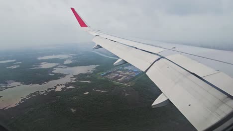 Wing-of-airplane-on-the-sky-and-solid-on-moving