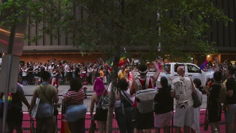 Floats-make-their-way-through-Pride-parade-and-celebration-as-people-look-on-in-Houston,-Texas