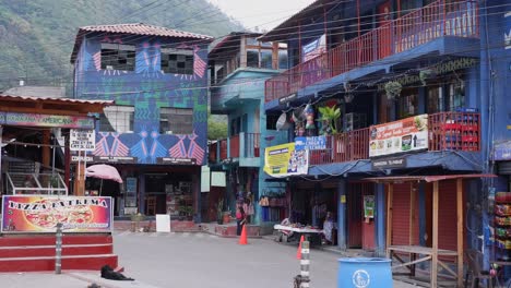 Colourful-Mayan-artwork-on-buildings-of-Santa-Catarina-Palopo,-Atitlan