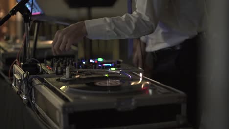 Disk-Jockey-Mixing-Vinyl-Disc-on-the-Board,-Close-Up