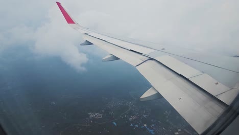 Wing-of-airplane-on-the-sky-and-solid-on-moving