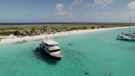 Yacht-docked-at-Klein-Curacao-island.-Drone-view