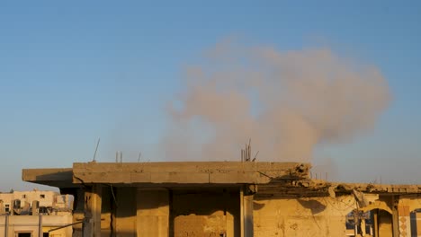 Remains-of-damaged-building-roof-lit-with-sunset-light-during-Israel-Hamas-war