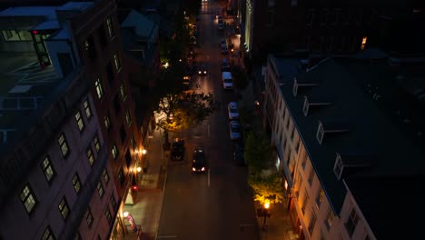 Rising-top-down-shot-of-traffic-scene-at-night-in-american-town