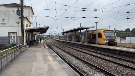 Passengers-walk-and-wait-for-trains-at-Ovar-Train-Station-in-Portugal