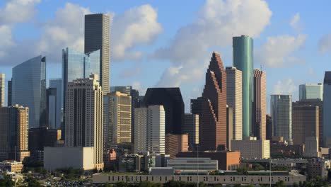Drone-view-of-downtown-Houston-skyline-and-cityscape-on-cloudy-but-sunny-day