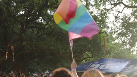 Large-Pride-flag-waving-in-wind-during-Pride-parade