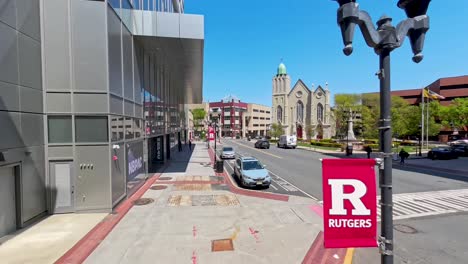 Walking-down-the-street-in-the-Theater-District-in-New-Brunswick,-NJ