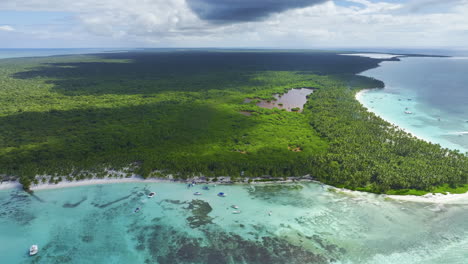 Panning-from-the-left-to-the-right-side-of-the-frame-above-a-coastal-area-where-resorts-are-located-in-the-islands-of-the-Dominican-Republic-in-the-Caribbean