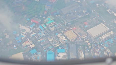 From-which-a-lot-of-clouds-and-a-big-industrial-zone-are-visible-from-the-plane