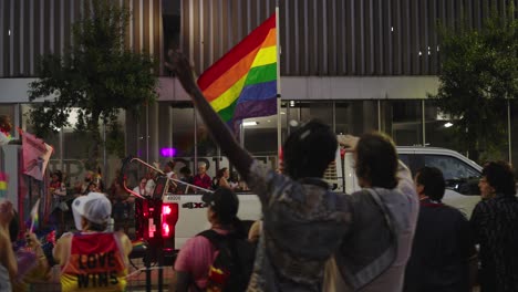 Truck-carrying-huge-Pride-flag-during-Pride-parade-and-celebration-in-Houston,-Texas