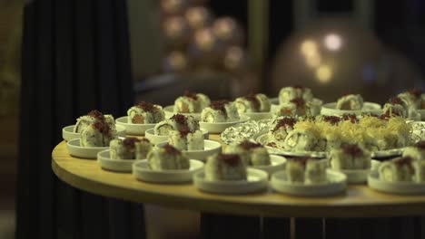 Big-Plate-of-sushi-rolls-arranged-neatly-on-a-wooden-table-at-an-event