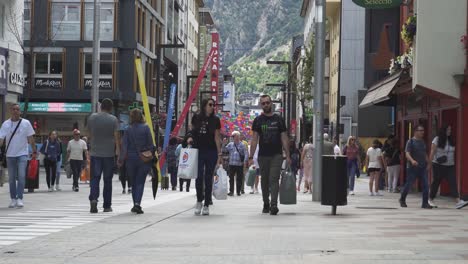 busy-street-in-Andorra-with-people-carrying-shopping-bags