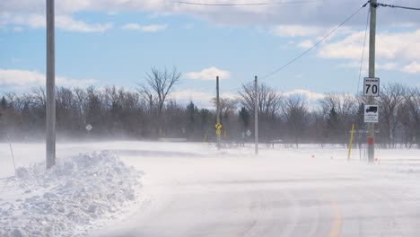 Blizzard-on-Empty-Country-Road,-Quebec,-Canada
