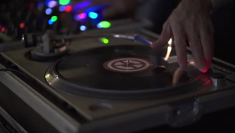 Disk-Jockey-Mixing-Vinyl-Disk-on-the-Board,-Close-Up