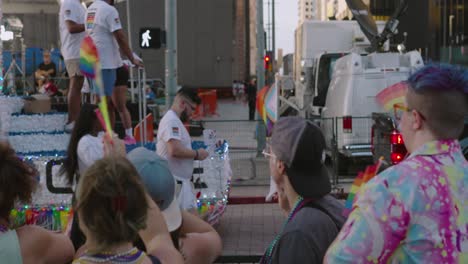 Participants-waving-Pride-flag-during-Pride-parade-in-downtown-Houston,-Texas