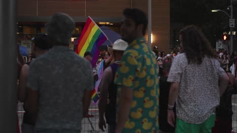 Person-carrying-the-Pride-flag-during-Pride-parade-in-Houston,-Texas