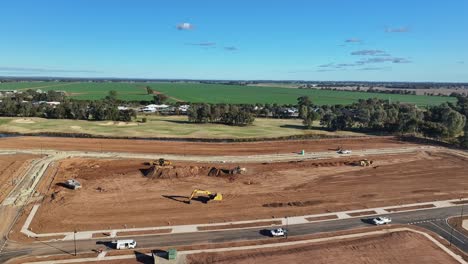 Descripción-Aérea-De-Maquinaria-Pesada-Trabajando-En-Un-Nuevo-Sitio-De-Construcción-Residencial