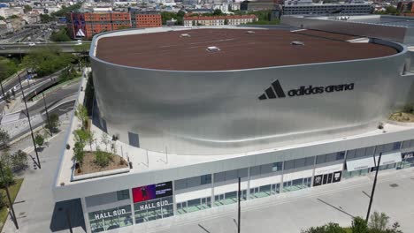 Adidas-Arena,-Paris-,-aerial-circular-drone-panoramic