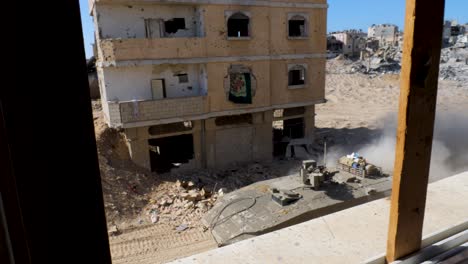 Israeli-Merkava-battle-tank-driving-through-concrete-rubble-and-bombed-street-of-Gaza,-Israel-military-ground-operation-in-war