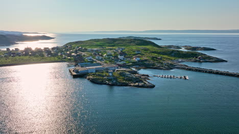 Aerial-view-orbiting-a-King-Crab-Production-factory-in-Bugoynes,-summer-in-Norway