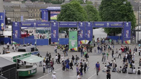 Busy-fanzone-entrance-to-public-viewing-in-Stuttgart,-Germany-during-Euro-2024,-far-wide-static