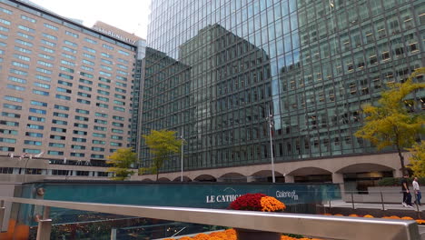 Urban-Colorful-Garden-and-Buildings-At-Esplanade-Ville-Marie-Downtown-Montreal-City,-Tilt-Up