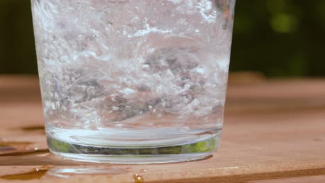 Natural-Mountain-Water-Being-Poured-into-Clear-Clean-Glass-in-Slow-Motion---Fresh-Summer-Concept-of-Health-and-Refreshment-4K