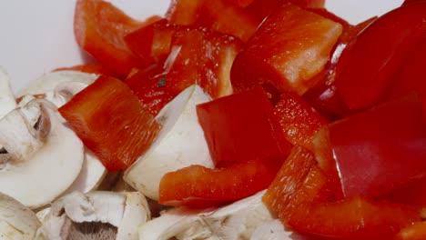 Close-Up-Overview-Of-Freshly-Cut-Mushrooms-and-Red-Bell-Pepper-in-Bowl-Ready-to-Cook---4K-Food-Prep-Clip