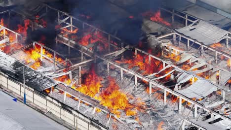 Telephoto-aerial-of-fire-ravaging-textile-factory-in-Santo-Domingo-industrial