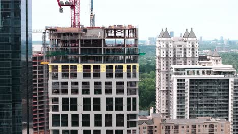 Drone-shot-of-construction-site-of-modern-apartment-skyline-building-in-Atlanta-Midtown