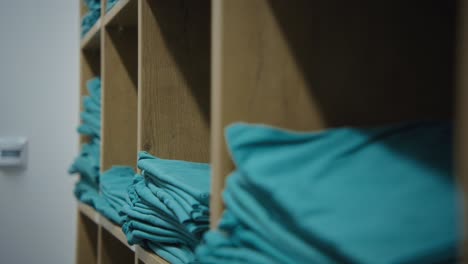 A-close-up-of-a-hand-taking-the-uniform-form-shelf