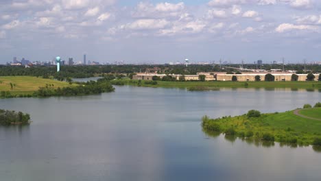 Drone-view-of-large-lake-in-West-Houston-with-the-Galleria-area-in-the-far-background