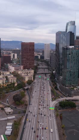 Vertical-Drone-Shot,-Los-Angeles-USA,-Traffic-on-CA-110-California-State-Route-by-Downtown