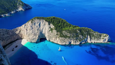 Aerial-View-Of-Navagio-Beach-With-Sailboat-In-Summer