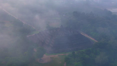 Drone-view-of-foggy-morning-over-Borobudur-Temple