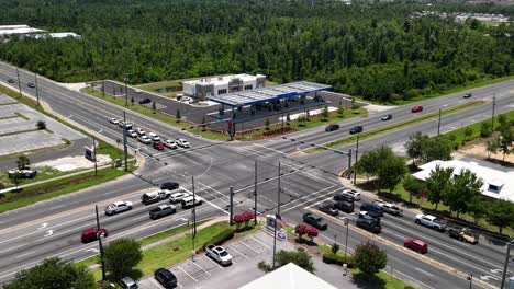 Cars-On-The-Intersection-Road-Following-Traffic-Rule-With-Buildings-Nearby-In-Panama-City,-Florida