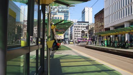 Passengers-Wait-For-Tram-At-St