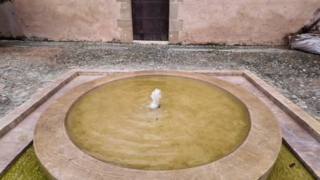Water-Fountain-made-of-marble-inside-riad-in-medina-of-Rabat,-Morocco